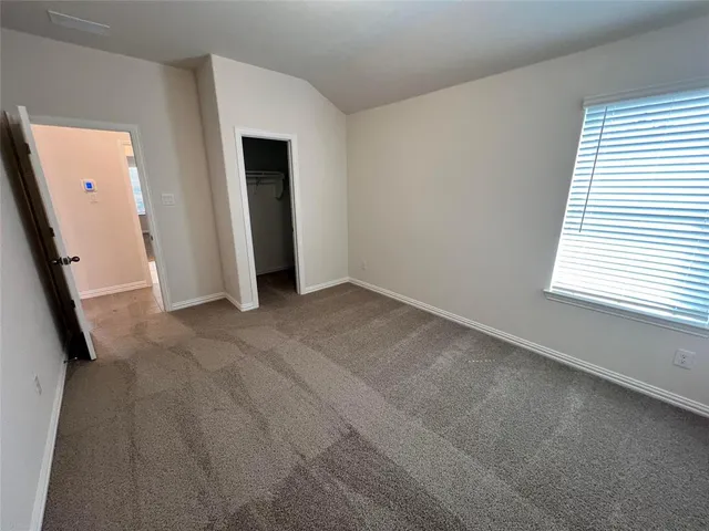 an empty room with a mirror