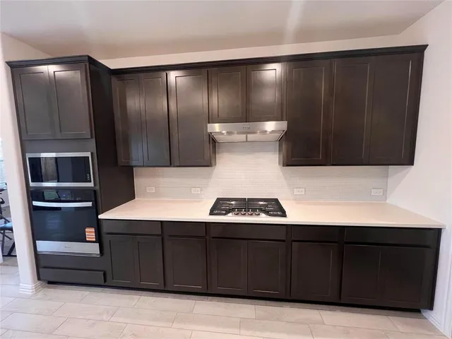a close view of kitchen with cabinets