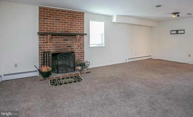 an empty room with a fireplace