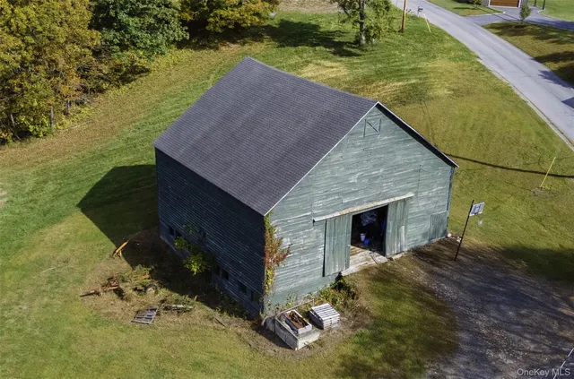 a aerial view of a house with a yard