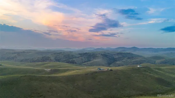 a view of an outdoor space and mountains