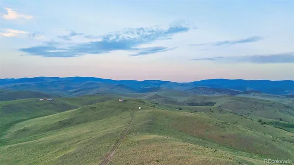 a view of a street with an ocean view
