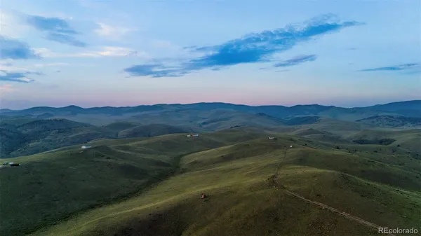 a view of an outdoor space and mountains