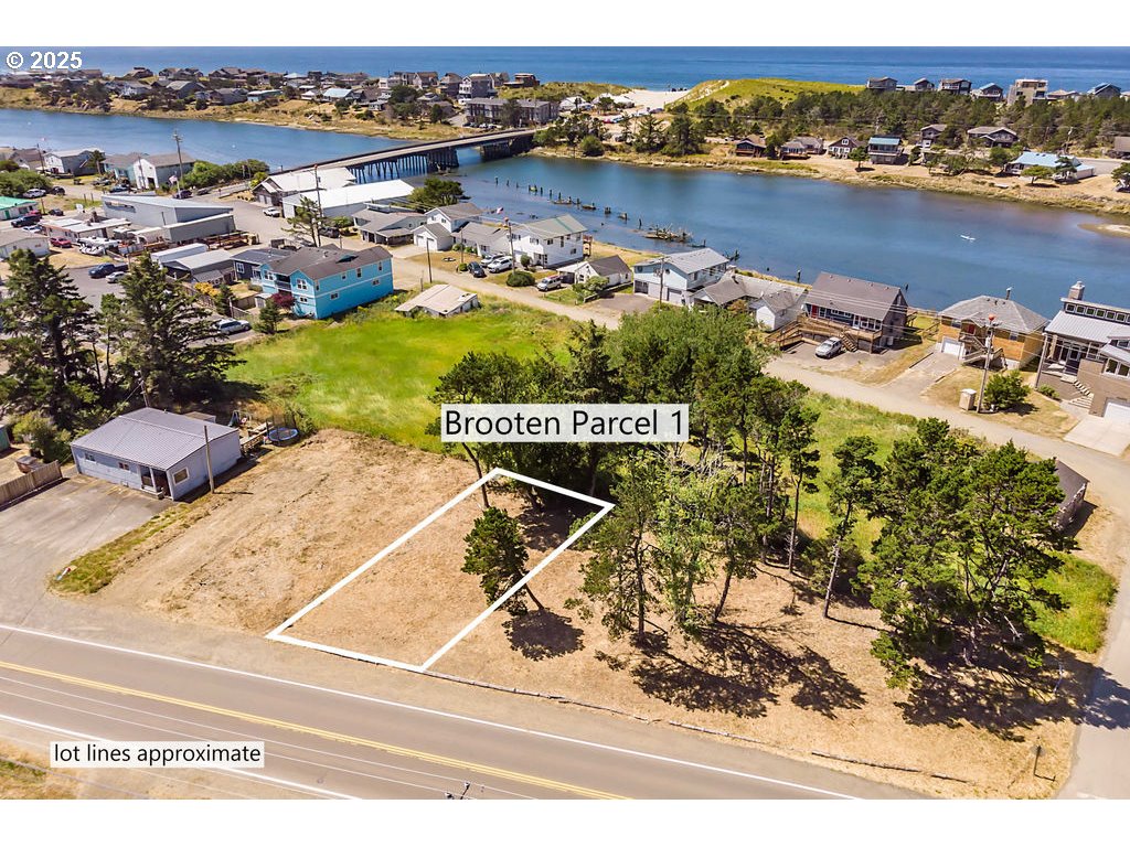 Brooten, Unit PARCEL1 Pacific City, OR 97135 - Photo 7 of 14 an aerial view of a house with a lake view