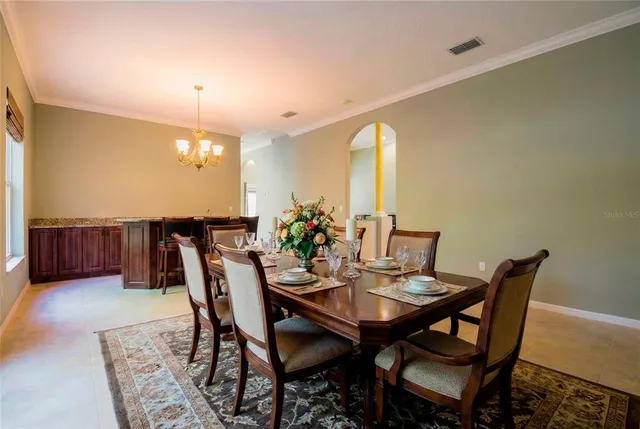 a kitchen with granite countertop a stove and a microwave
