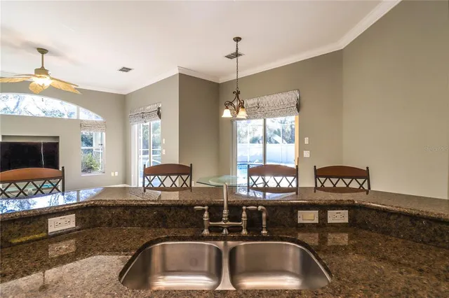 a view of a livingroom with furniture and a potted plant