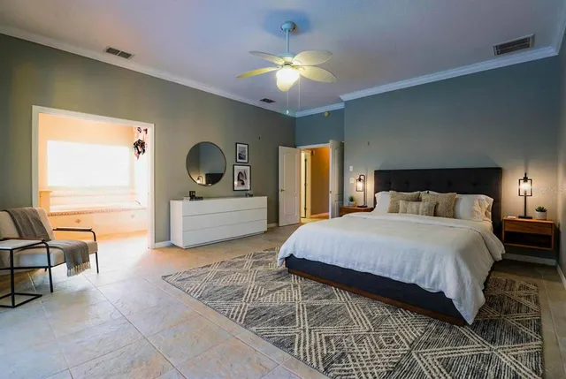 a view of a house with backyard and a tree