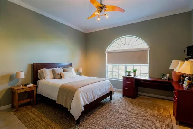 a backyard of a house with barbeque oven and trees