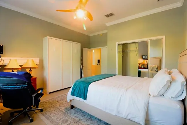 a backyard of a house with barbeque oven and outdoor seating