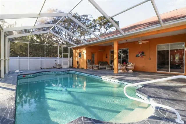 an aerial view of a house with a yard and garden