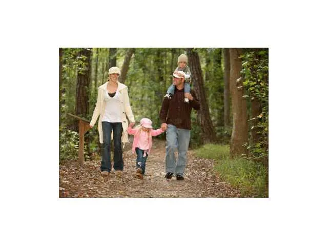 a group of people sitting in a yard