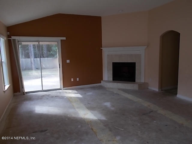 938 Cherry Point Way Jacksonville, FL 32218 - Photo 11 of 34 a view of empty room with a fireplace