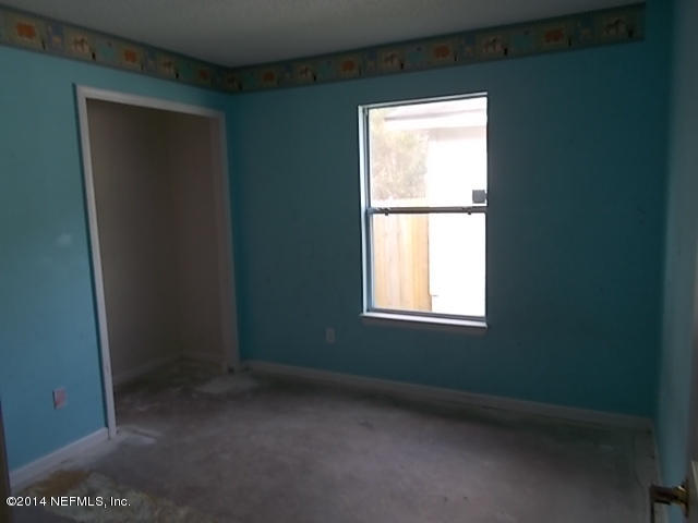 938 Cherry Point Way Jacksonville, FL 32218 - Photo 15 of 34 a view of an empty room with a window