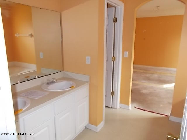 938 Cherry Point Way Jacksonville, FL 32218 - Photo 21 of 34 a bathroom with a sink and a mirror