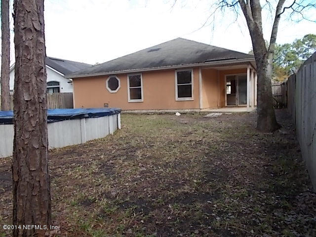 938 Cherry Point Way Jacksonville, FL 32218 - Photo 31 of 34 a view of a house with a yard