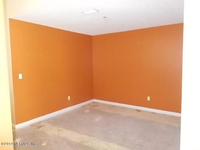 938 Cherry Point Way Jacksonville, FL 32218 - Photo 7 of 34 a view of a big room with an empty space