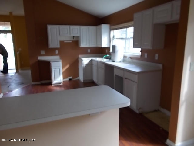 938 Cherry Point Way Jacksonville, FL 32218 - Photo 10 of 34 a kitchen with a sink a window and cabinets