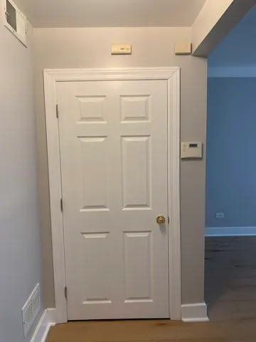 a hallway with wooden floor