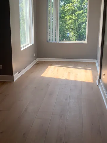 a view of small pool with seating area