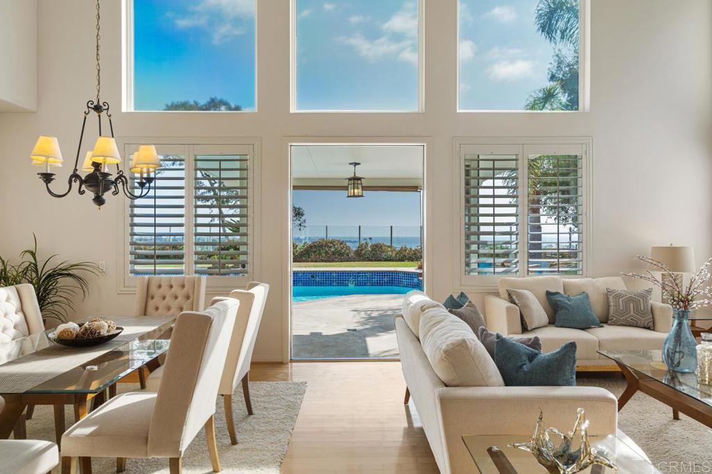 7357 Melodia Terrace Carlsbad, CA 92011 - Photo 11 of 60 a living room with furniture and a potted plant