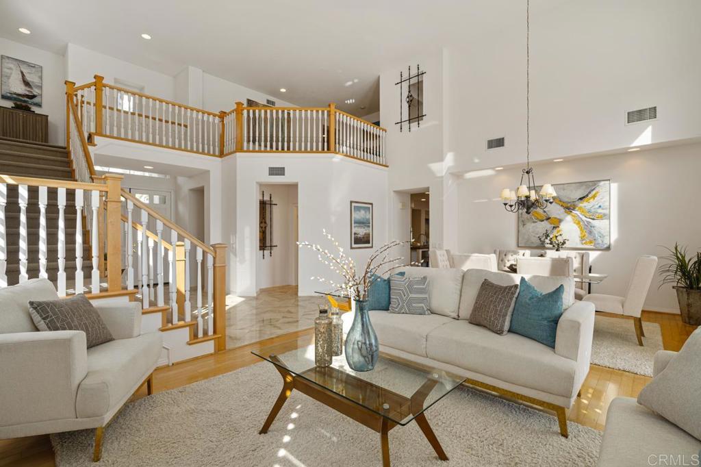 7357 Melodia Terrace Carlsbad, CA 92011 - Photo 14 of 60 a living room with furniture and kitchen view