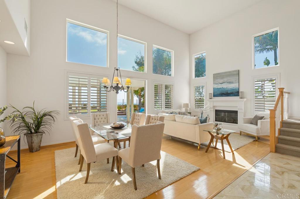7357 Melodia Terrace Carlsbad, CA 92011 - Photo 16 of 60 a living room with fireplace furniture and a large window