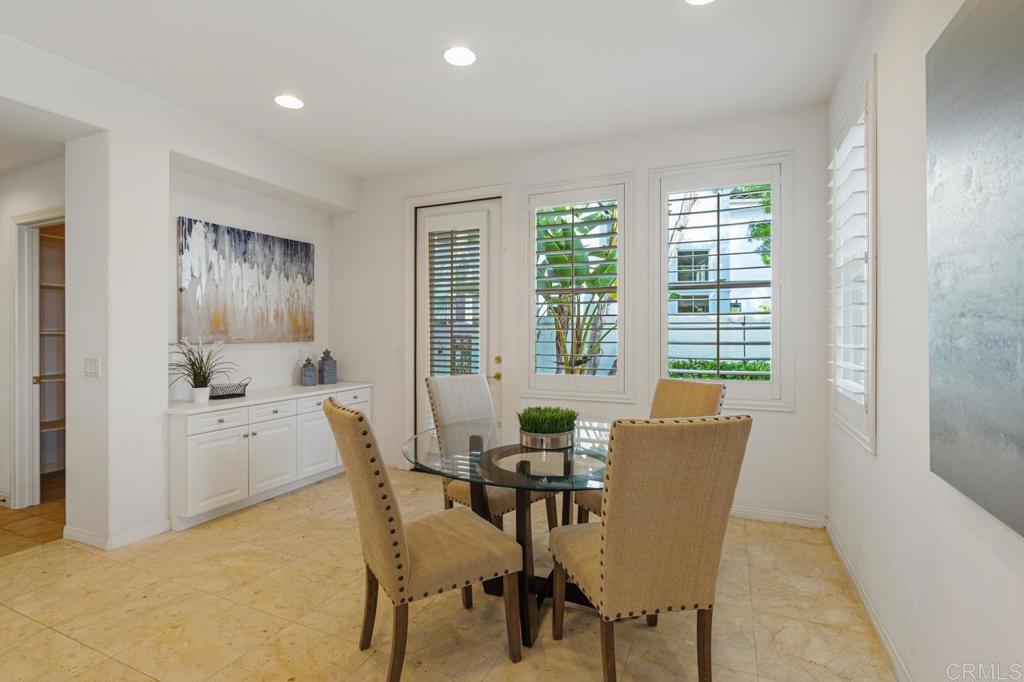7357 Melodia Terrace Carlsbad, CA 92011 - Photo 24 of 60 a dining room with furniture and window