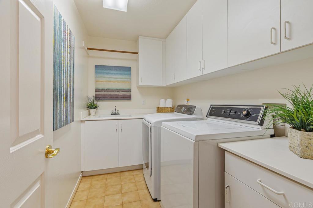 7357 Melodia Terrace Carlsbad, CA 92011 - Photo 26 of 60 a utility room with dryer and washer