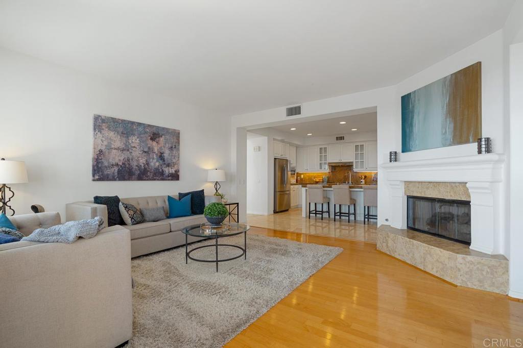 7357 Melodia Terrace Carlsbad, CA 92011 - Photo 28 of 60 a living room with furniture and a fireplace