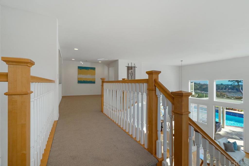 7357 Melodia Terrace Carlsbad, CA 92011 - Photo 30 of 60 a view of a hallway with windows