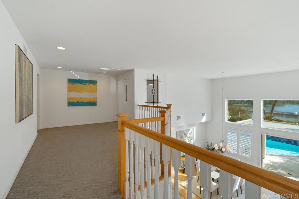 7357 Melodia Terrace Carlsbad, CA 92011 - Photo 31 of 60 a view of a hallway with windows