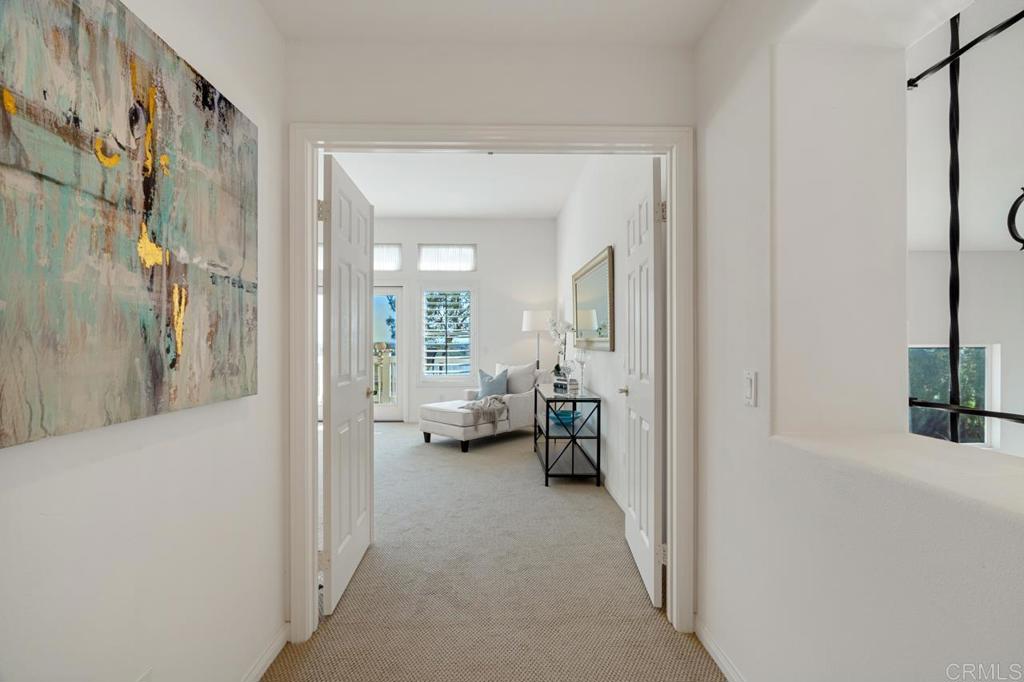 7357 Melodia Terrace Carlsbad, CA 92011 - Photo 33 of 60 a view of a livingroom with furniture and a hallway