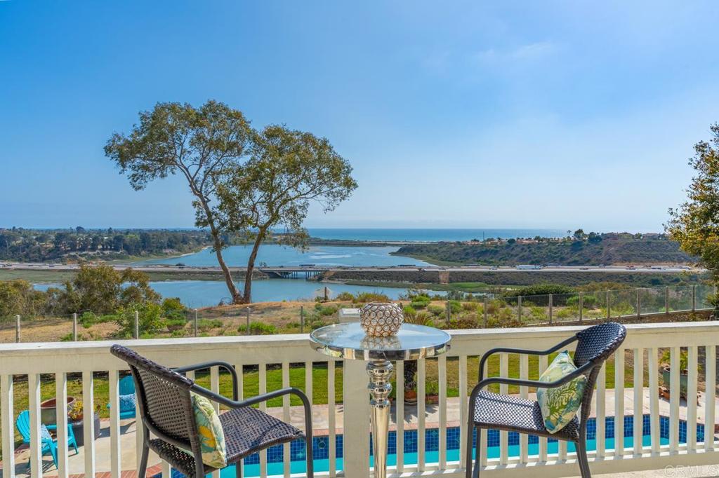 7357 Melodia Terrace Carlsbad, CA 92011 - Photo 38 of 60 a terrace with outdoor seating and city view