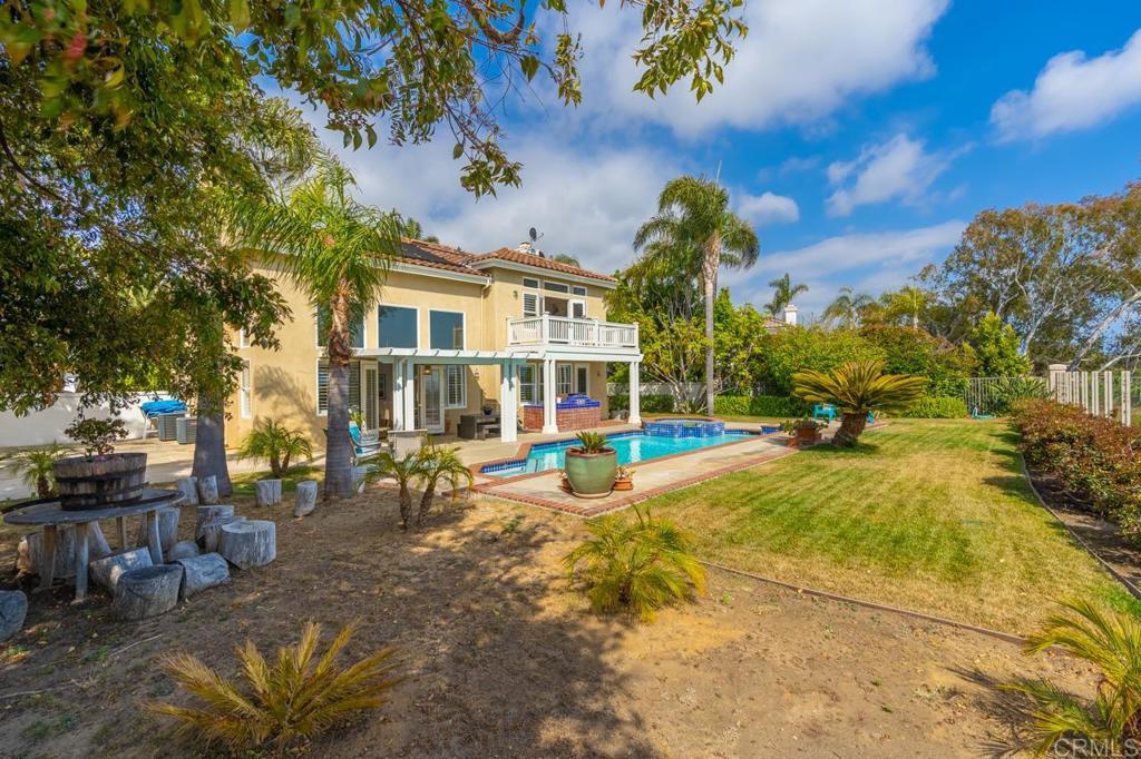 7357 Melodia Terrace Carlsbad, CA 92011 - Photo 55 of 60 a view of a house with swimming pool and sitting area