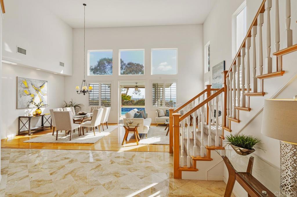 7357 Melodia Terrace Carlsbad, CA 92011 - Photo 8 of 60 a living room with lots of furniture and a large window