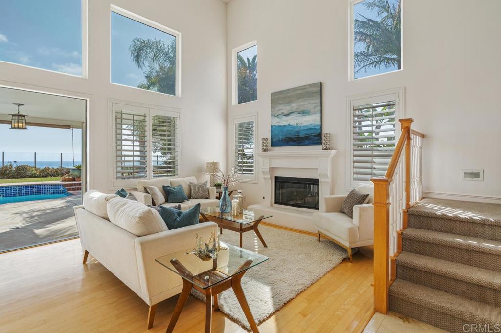7357 Melodia Terrace Carlsbad, CA 92011 - Photo 10 of 60 a living room with furniture and a fireplace