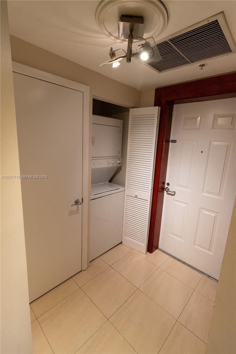 7275 Southwest 90th Way, Unit 213 Miami, FL 33156 - Photo 7 of 31 a view of a hallway with entryway