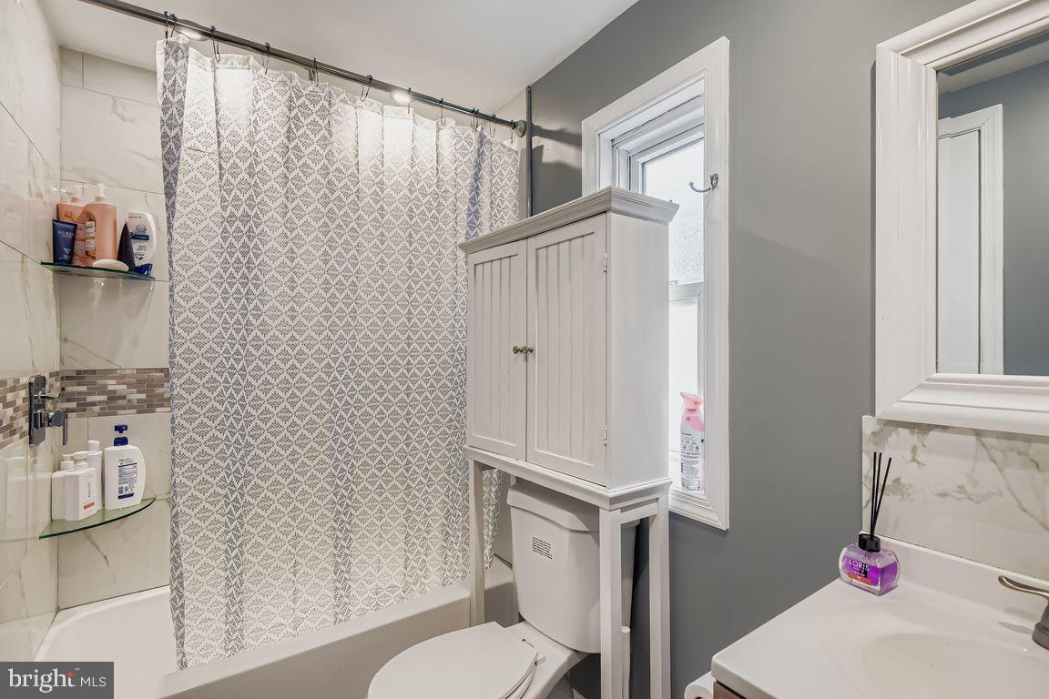 7810 Clark Road, Unit D64 Jessup, MD 20794 - Photo 20 of 28 a bathroom with a toilet and a shower