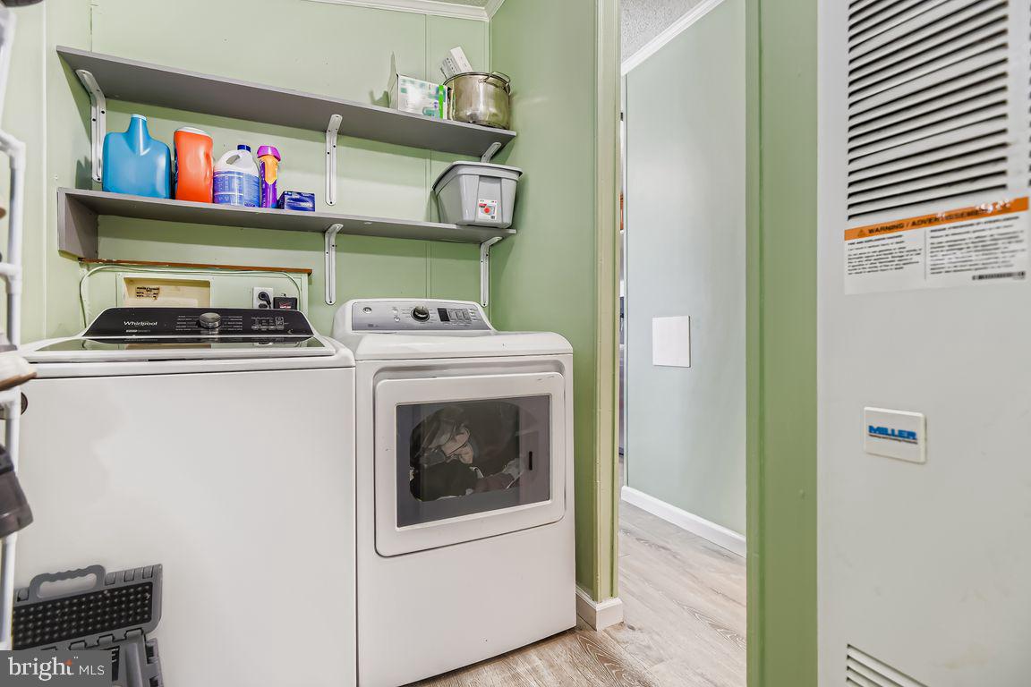 7810 Clark Road, Unit D64 Jessup, MD 20794 - Photo 21 of 28 a utility room with dryer and washer
