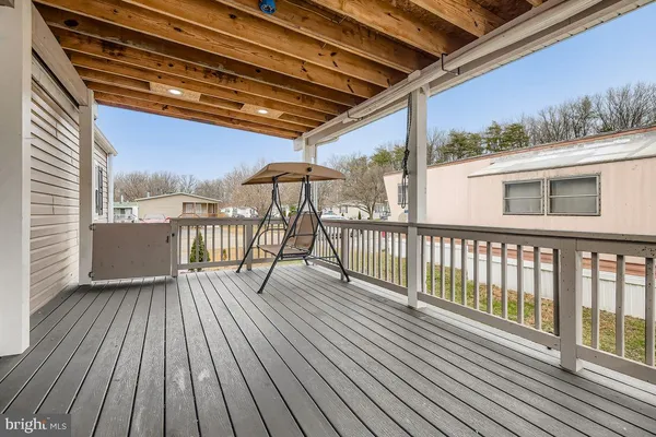 a view of a balcony with wooden floor