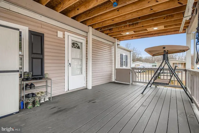a view of a patio with wooden floor