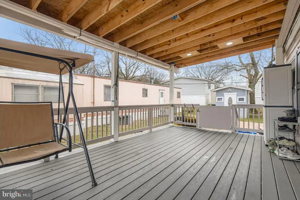 a view of a porch with wooden floor