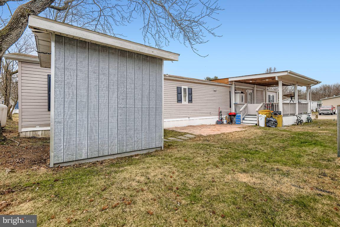 7810 Clark Road, Unit D64 Jessup, MD 20794 - Photo 26 of 28 a view of a house with backyard and sitting area
