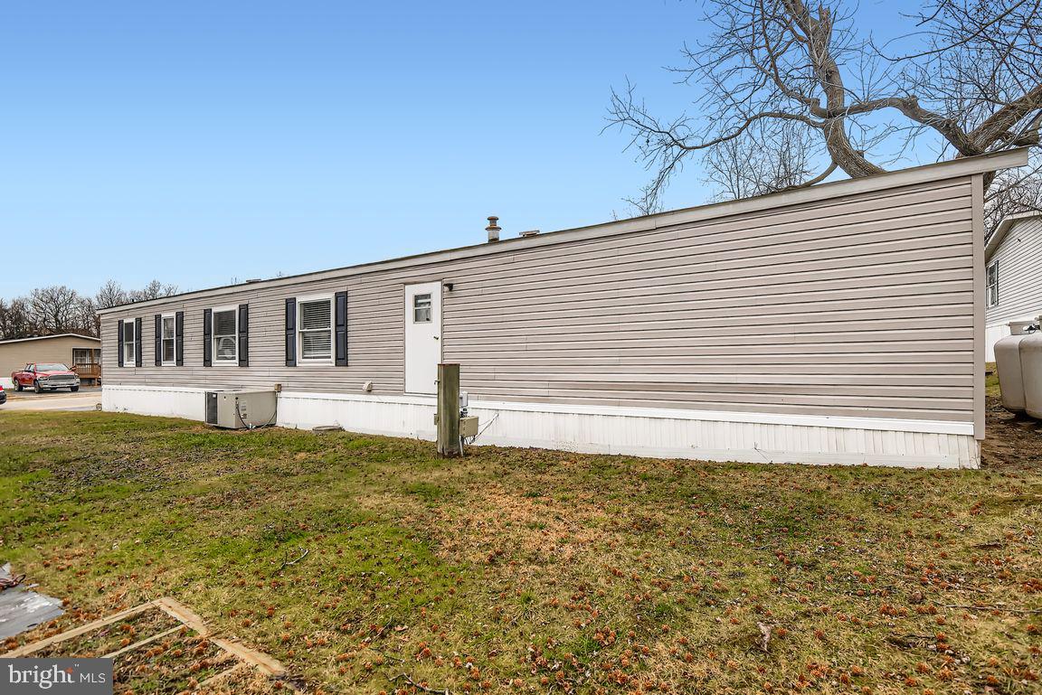 7810 Clark Road, Unit D64 Jessup, MD 20794 - Photo 27 of 28 a view of a house with a yard