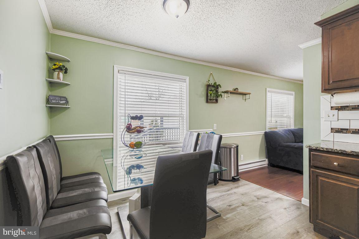 7810 Clark Road, Unit D64 Jessup, MD 20794 - Photo 8 of 28 a view of a livingroom with furniture window and wooden floor
