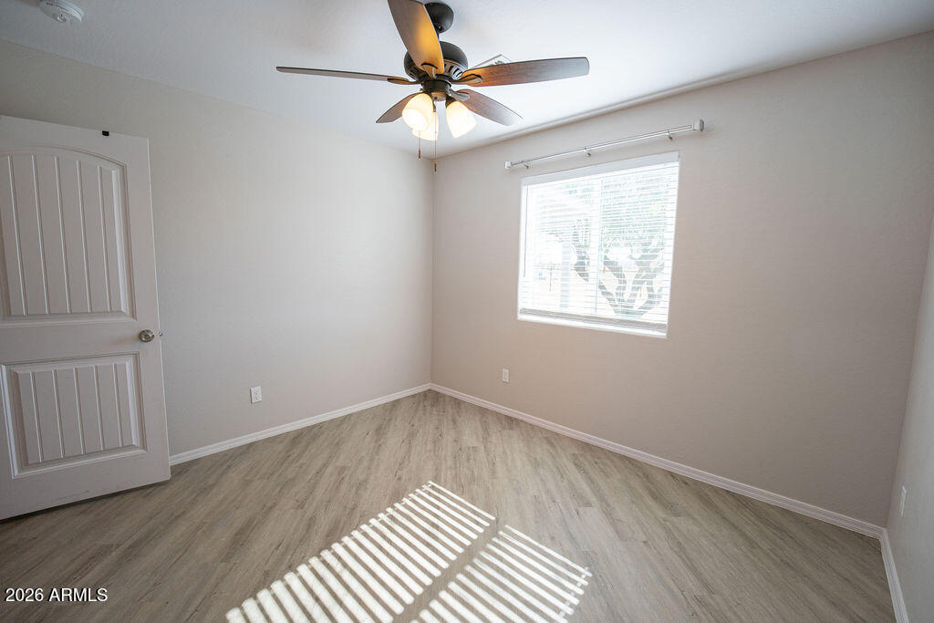 19643 East Rojo Road Florence, AZ 85132 - Photo 25 of 45 wooden floor in an empty room with a window