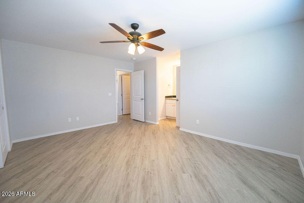 19643 East Rojo Road Florence, AZ 85132 - Photo 33 of 45 a view of an empty room and wooden floor