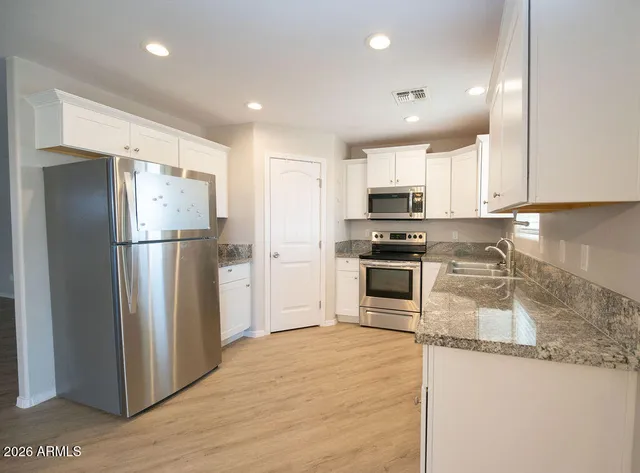 a view of a backyard of the house