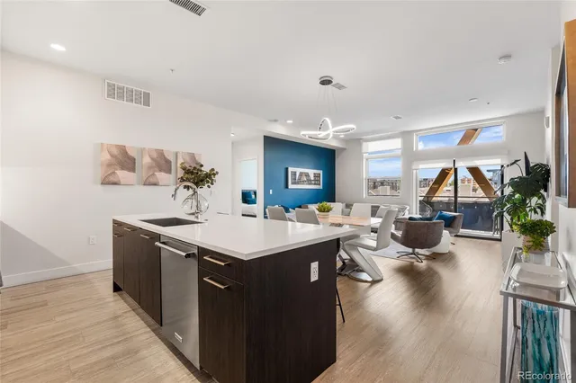 a kitchen with sink stove and cabinets