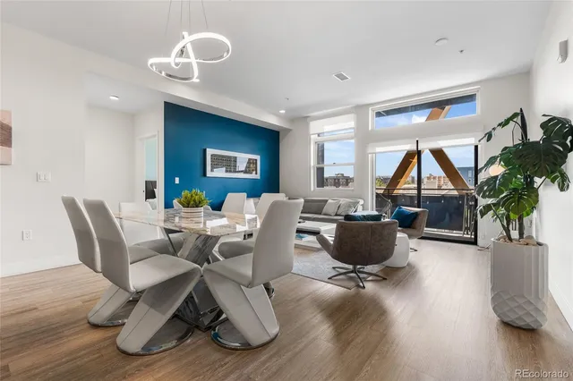 a living room with furniture rug and wooden floor